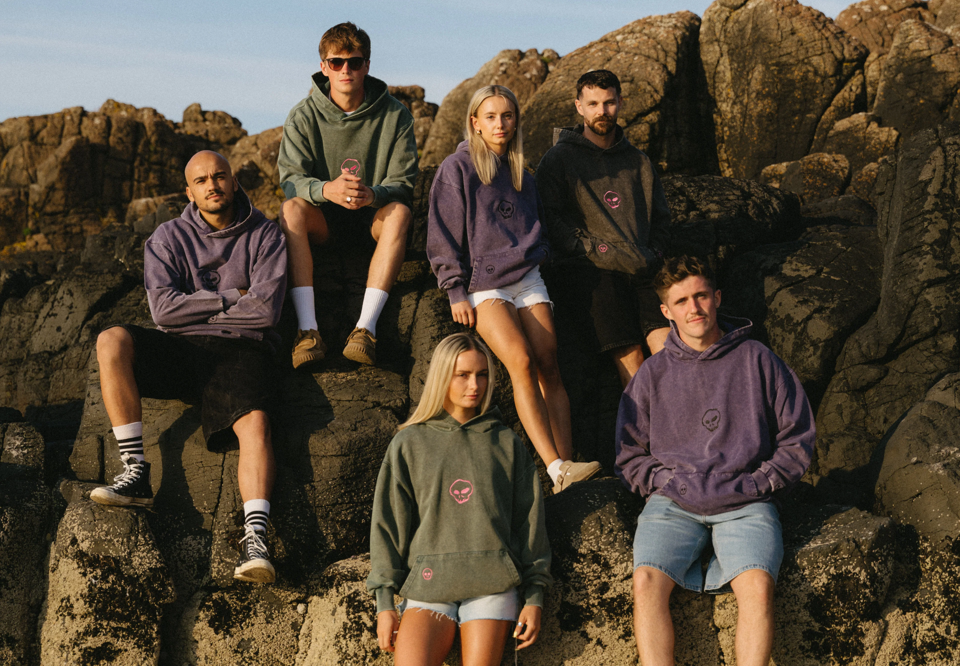 Group of people wearing hoodies on rocky terrain1621243260e1af0c20-2